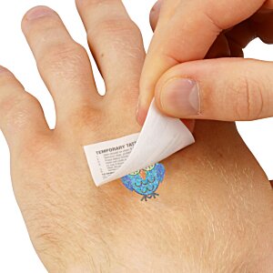 Additional Image 1 - a person removing a small piece of paper on a hand