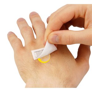 Additional Image 1 - a person putting a small white object on a hand