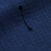 a black thread on a blue fabric