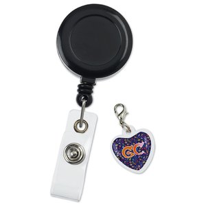Additional Image 1 - a black badge with a white tag and a purple heart
