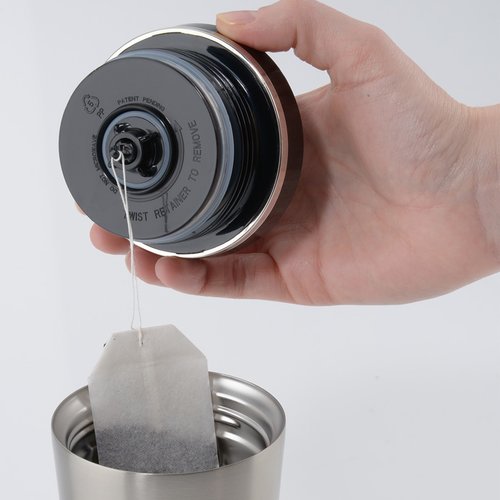 Additional Image 1 - a hand holding a can of tea