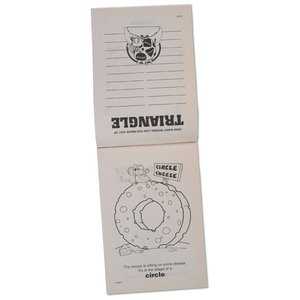Additional Image 1 - a white remote control with a round button