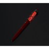 a red pen on a black background