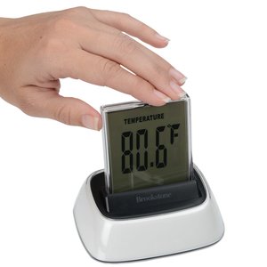 Additional Image 5 - a hand holding a digital clock
