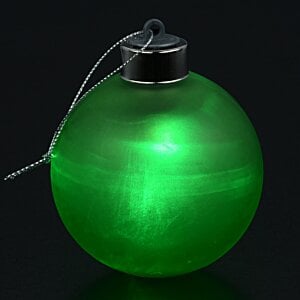 Additional Image 1 - a green round object with a string