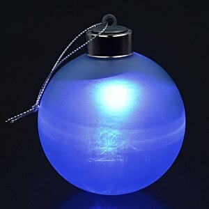 Additional Image 2 - a blue round object with a string