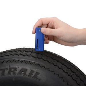 Additional Image 4 - a hand holding a tire