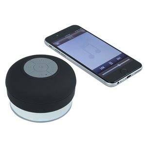 Additional Image 2 - a cell phone next to a round black object