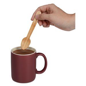 Additional Image 3 - a hand holding a spoon over a cup