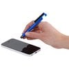 a hand holding a pen and a cell phone