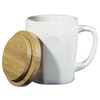 a white mug with a wooden lid