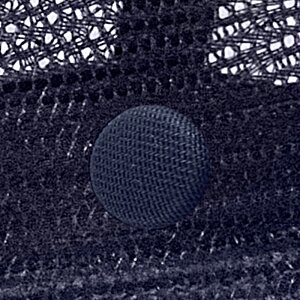 Additional Image 3 - a black circle on a mesh surface