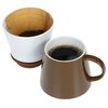 a coffee mugs with a white cup next to each other