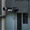 a grey door with a pipe