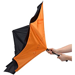Additional Image 4 - a person holding an orange and black umbrella