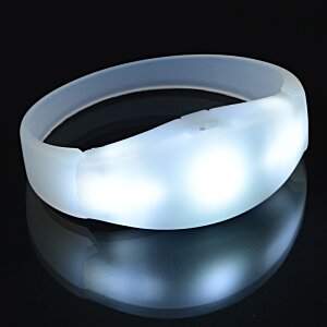 Additional Image 9 - a white rubber bracelet on a black surface
