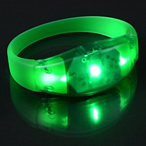 Additional Image 4 - a green bracelet on a black surface