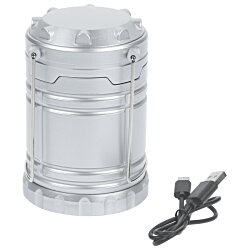 a silver cylinder with a black cord