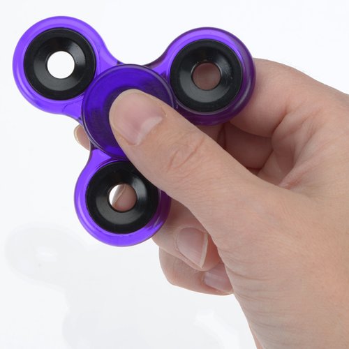 Additional Image 1 - a hand holding a purple fidget spinner