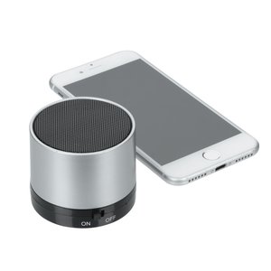 Additional Image 2 - a white cell phone next to a round cylindrical object