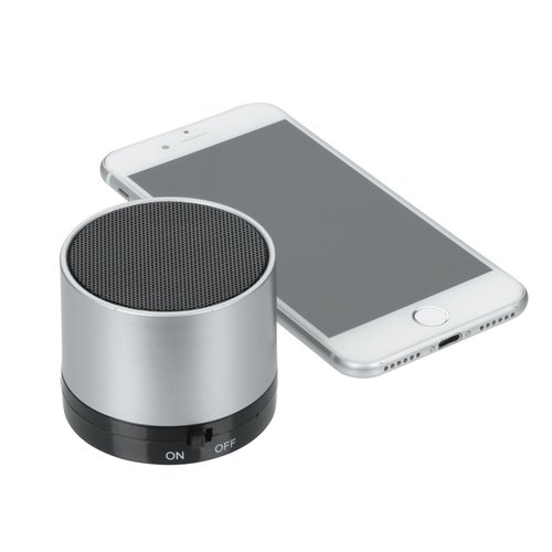 Additional Image 2 - a white cell phone next to a round cylindrical object