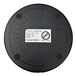 a black circular object with a white label