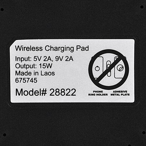 Additional Image 6 - a white and black label with a circle and a black circle