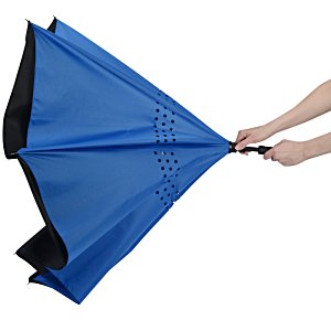 Additional Image 3 - a person holding a blue umbrella
