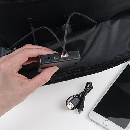 Additional Image 3 - a hand holding a black device