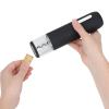 Additional Image 3 - a person holding a black and silver canister