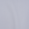 a white surface with a black spot