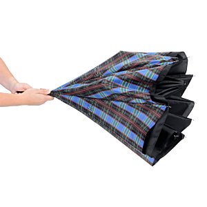 Additional Image 3 - a person holding a black and blue umbrella