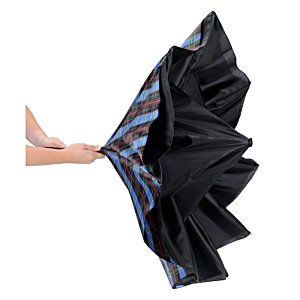 Additional Image 4 - a hand holding a black and blue umbrella