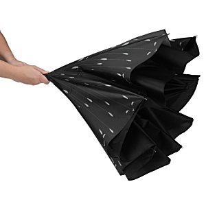 Additional Image 2 - a person holding a black umbrella