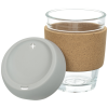 a glass with a brown sleeve and a white lid