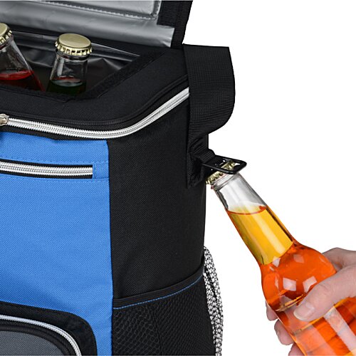 Additional Image 3 - a hand holding a bottle of orange liquid