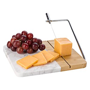 Additional Image 3 - a cheese and grapes on a cutting board