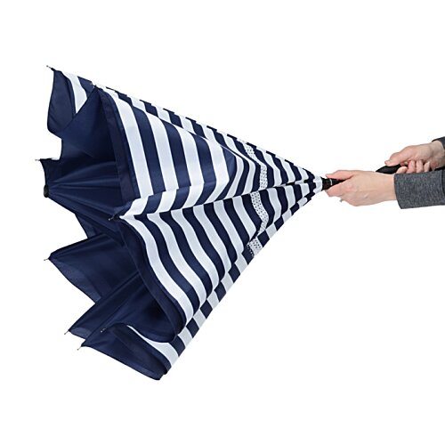 Additional Image 1 - a hand holding a blue and white striped umbrella