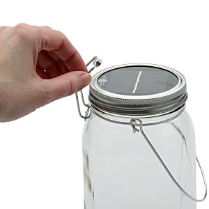 Additional Image 3 - a hand holding a glass jar