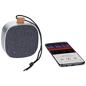 Additional Image 4 - a round speaker next to a remote control