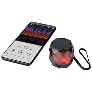 Additional Image 1 - a remote control and a round object