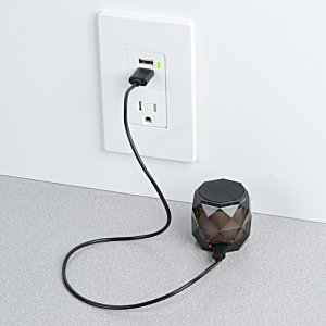 Additional Image 5 - a black cord plugged into a wall outlet