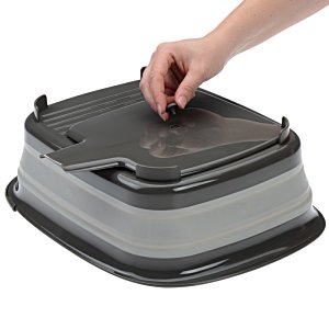 Additional Image 2 - a hand holding a black and grey container