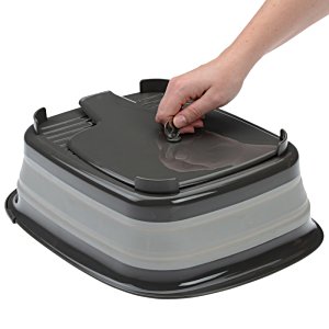 Additional Image 3 - a hand holding a black and grey container