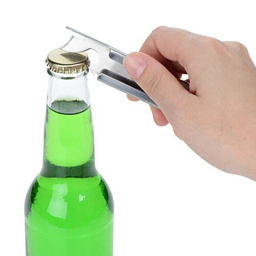 Additional Image 2 - a hand holding a lighter over a green bottle