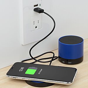 Additional Image 1 - a smart phone and a speaker plugged into a wall outlet