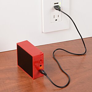 Additional Image 1 - a red rectangular object with a black cord plugged into a wall outlet