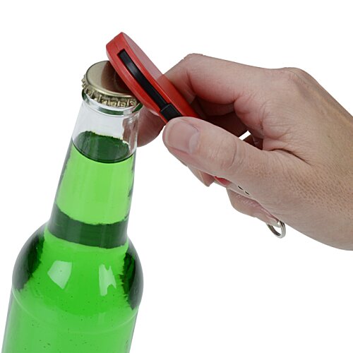 Additional Image 4 - a hand opening a bottle of green liquid