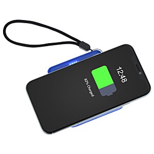 a black cell phone with a green screen