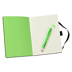 a green pen on a piece of paper